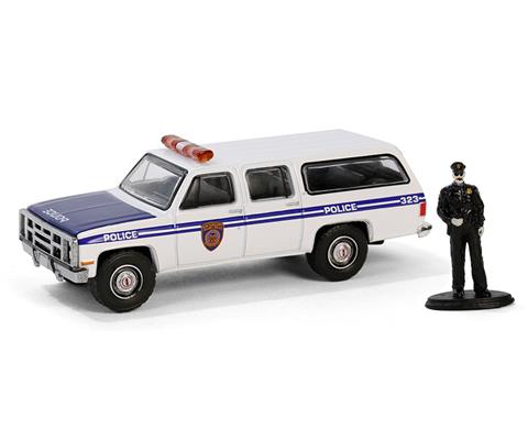Greenlight Collectibles 1985 GMC Suburban 2500 with Police Officer Figure